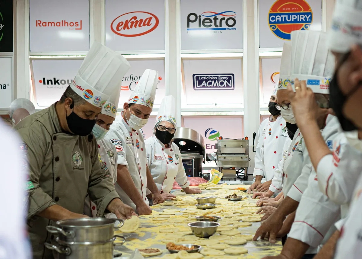 Digital Marketing Agency | ZenWeb Malaysia Cooks plating dishes to order in a restaurant kitchen