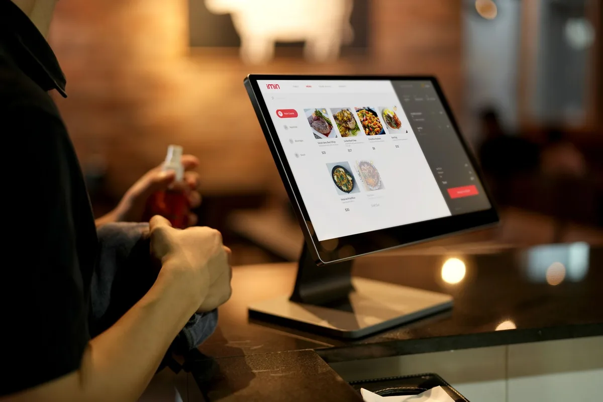 Digital Marketing Agency | ZenWeb Malaysia A customer placing an order on a restaurant touchscreen