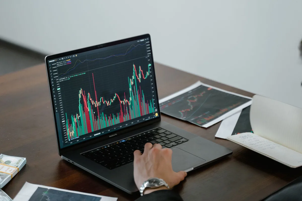 Digital Marketing Agency | ZenWeb Malaysia A graph displayed on a laptop screen in a working office
