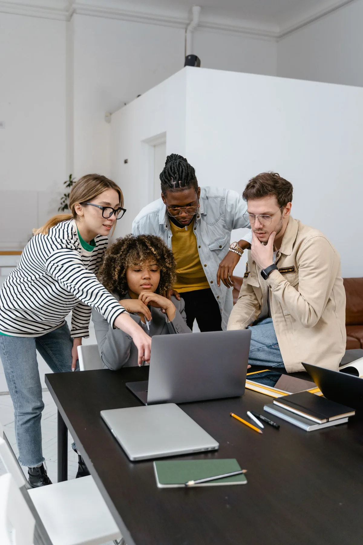 Digital Marketing Agency | ZenWeb Malaysia A group of colleagues planning a build while looking at a laptop