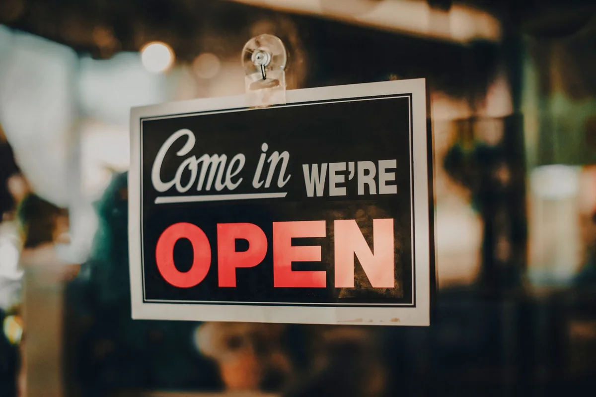 Digital Marketing Agency | ZenWeb Malaysia An open sign hanging in a shop doorway