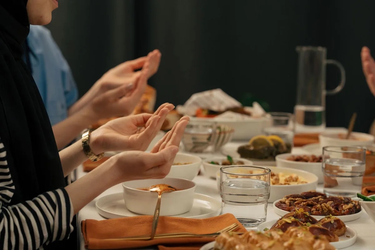 People gathered around a table for an iftar meal during Ramadan