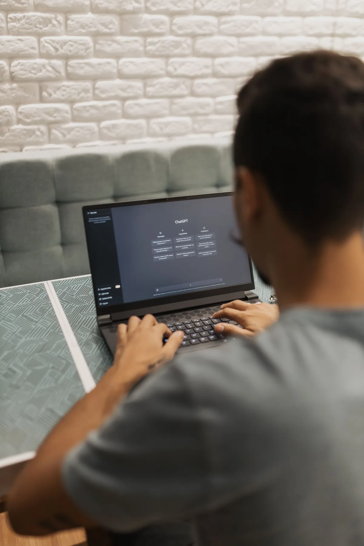 Digital Marketing Agency | ZenWeb Malaysia A person using an AI assistant on a laptop screen